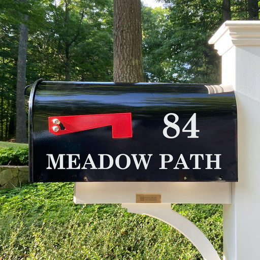Personalized black mailbox with full address.